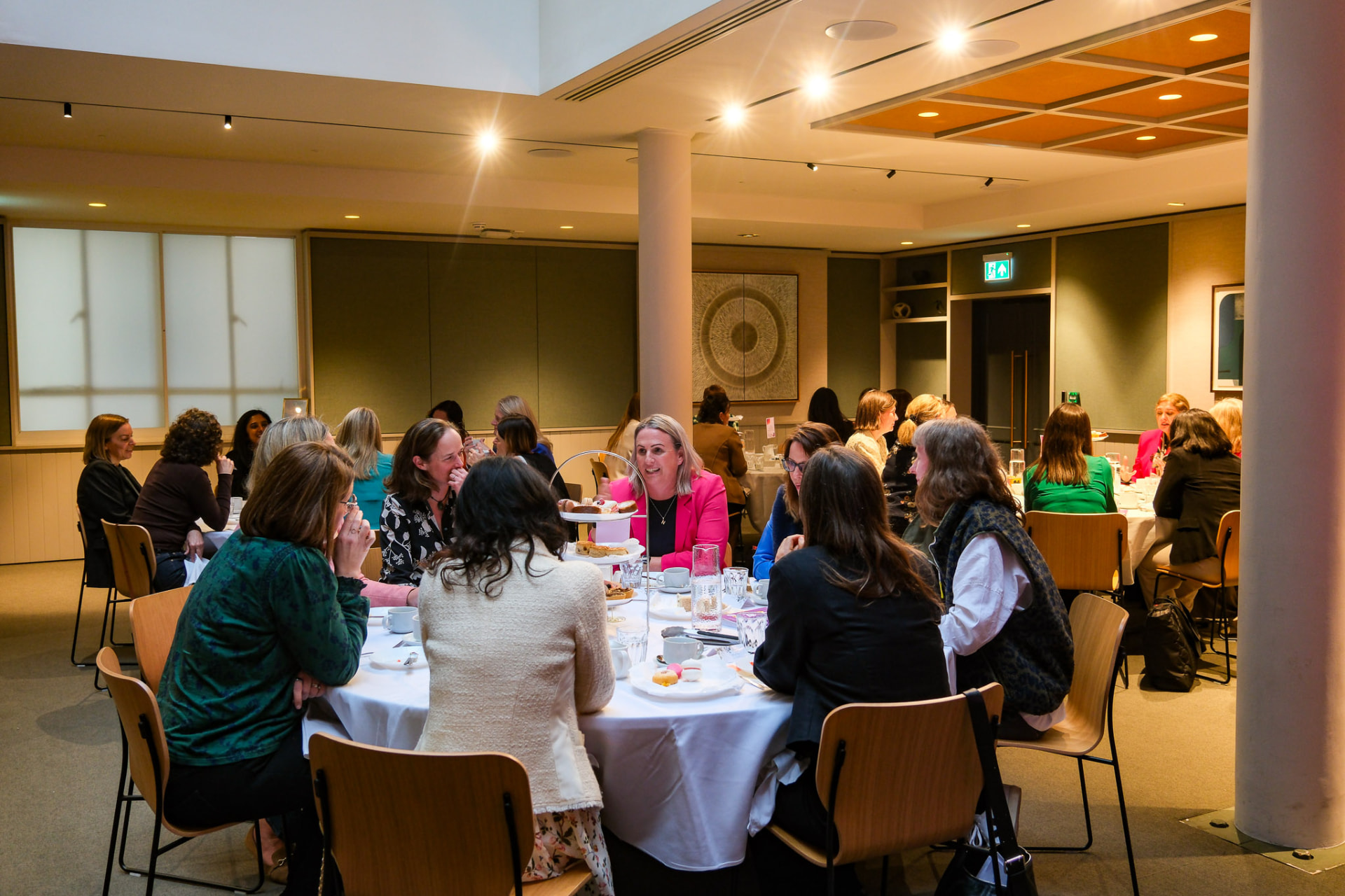 Women in conversation at an EmpowerHER gathering