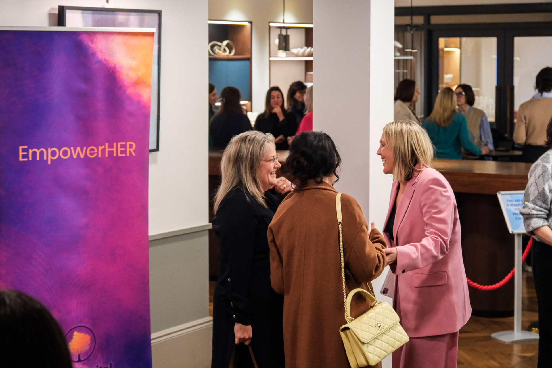 Women in conversation at an EmpowerHER event